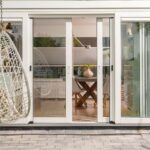 Modern sliding patio doors create a bright, seamless connection between home and garden.